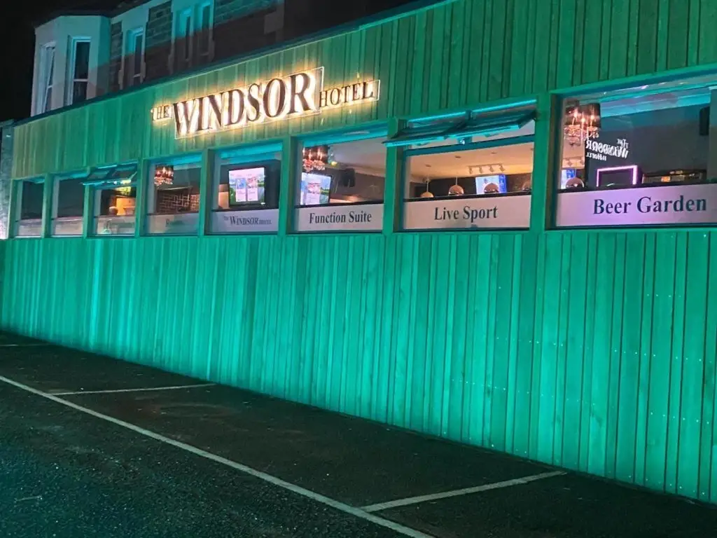 The Windsor Hotel facade with illuminated windows showing Function Suite, Live Sport and Beer Garden